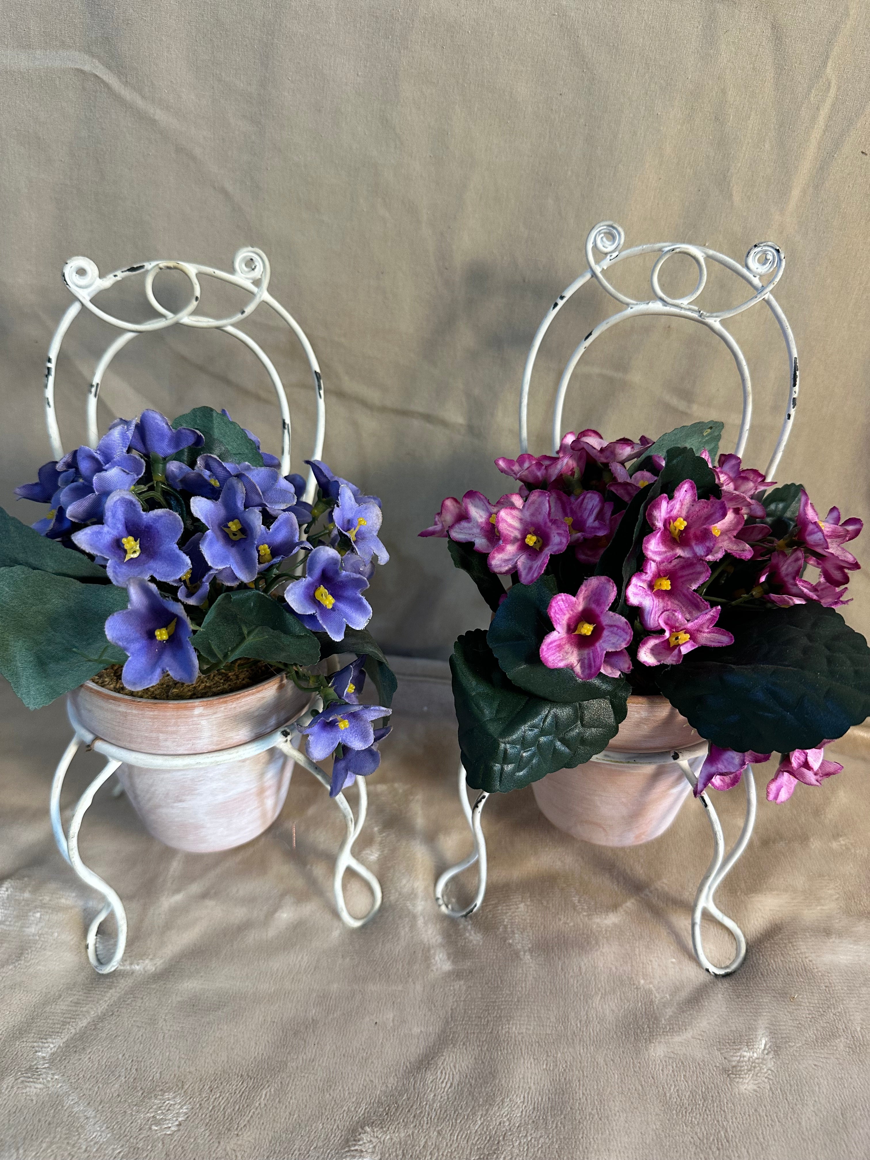 Set of 2 metal chair plant holders with silk flowers in pots